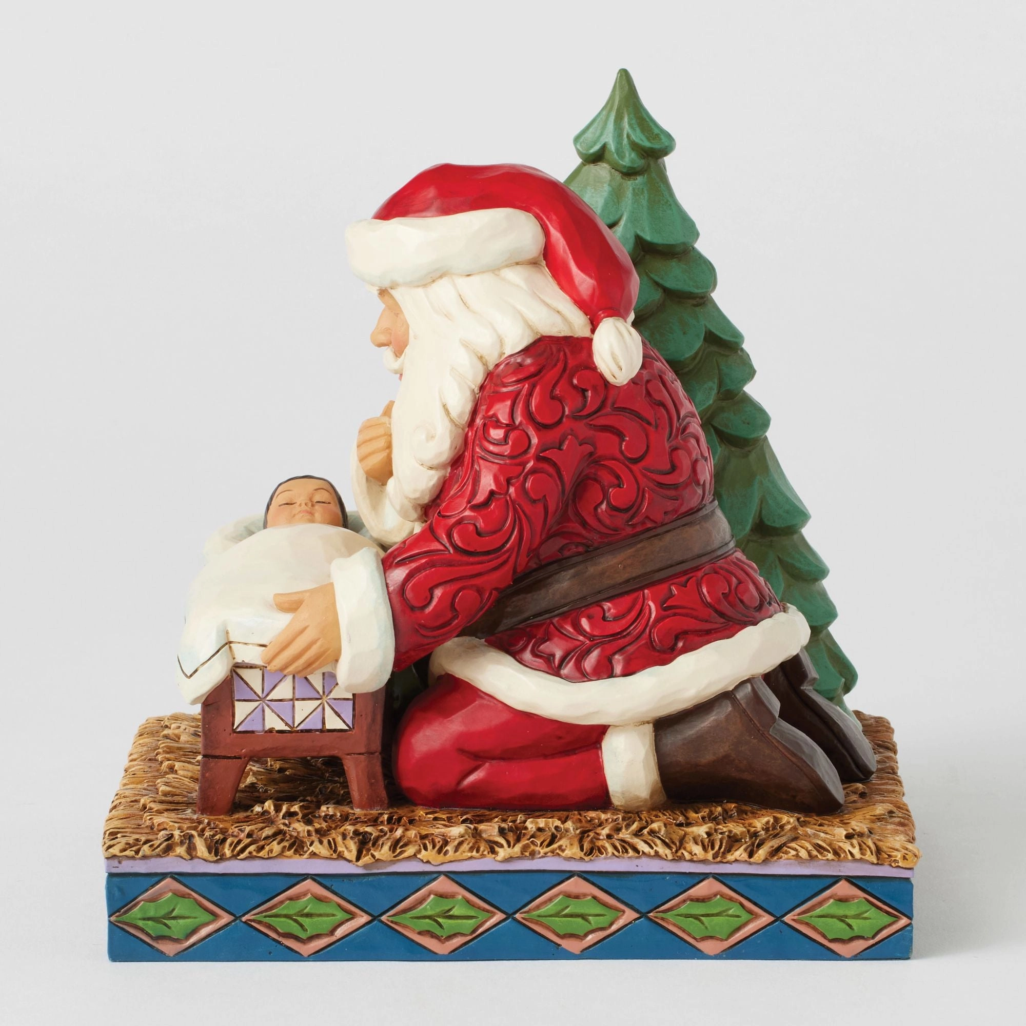 Santa Kneeling over Baby Jesus