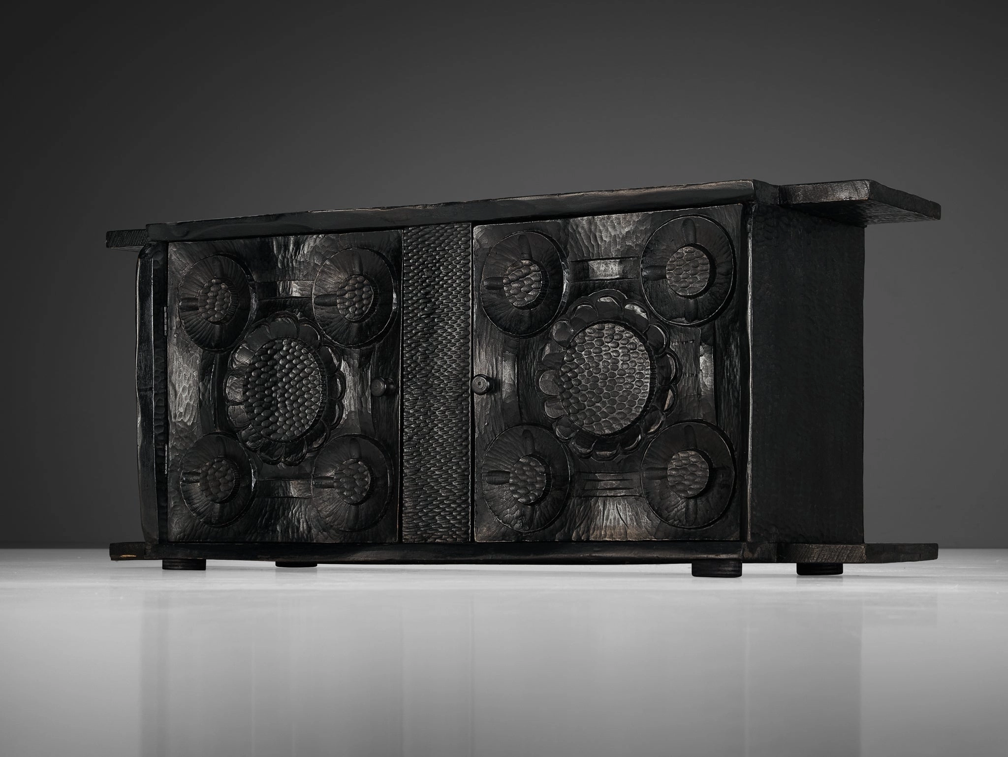 Sculptural Trunk in Black Lacquered Wood with Decorative Carvings